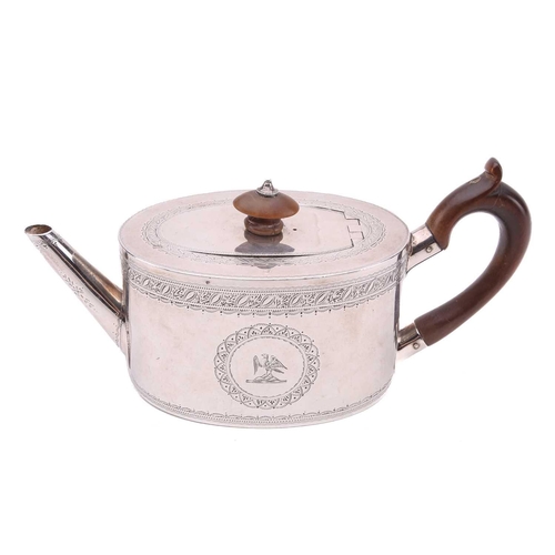 468 - A small Victorian bachelor teapot, in George III style, oval with foliate engraved bands and a crest... 