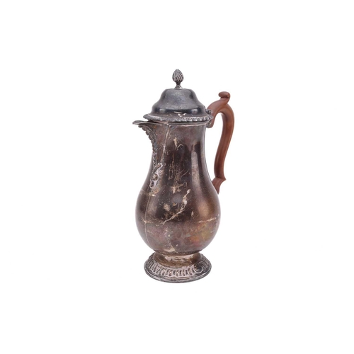 475 - A silver hot water jug; baluster form with gadrooned borders and beaded mount to spout, wooden scrol... 