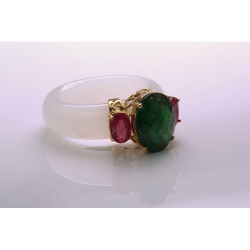 48 - A carved white nephrite jade ring set with tsavorite and rubies, with a D-section band carved out of... 