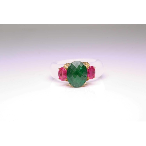 48 - A carved white nephrite jade ring set with tsavorite and rubies, with a D-section band carved out of... 