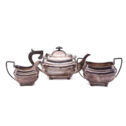 485 - An early 20th century three piece silver tea set, Sheffield 1910, by Fordham & Faulkner, with squat ... 