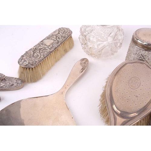 491 - A collection of silver items of silver backed dressing table appointments including brushes, mirror,... 