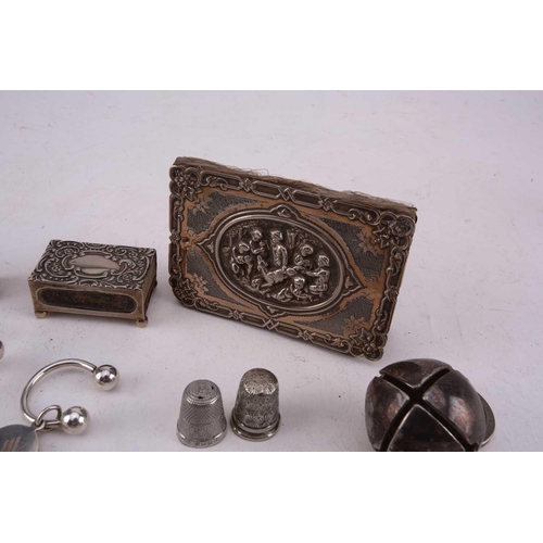 493 - A collection of silver and white metal comprising a miniature flask with screw cover, a silver match... 