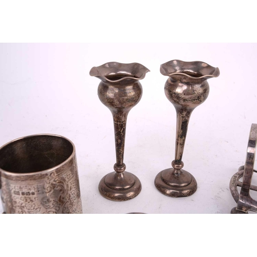 494 - A small collection of silver and silver plate comprising a silver christening mug overall decorated ... 