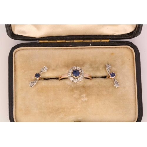 5 - A Sapphire and Diamond cluster ring and earring set, the ring is formed from a central claw set sapp... 