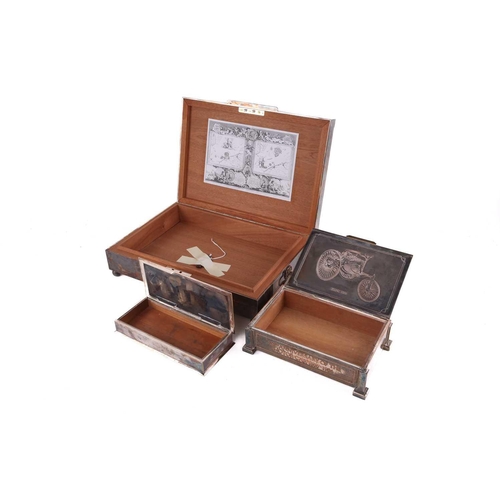 500 - Three silver plated cigar boxes comprising a humidor with a hinged cover inset with a 20th century p... 