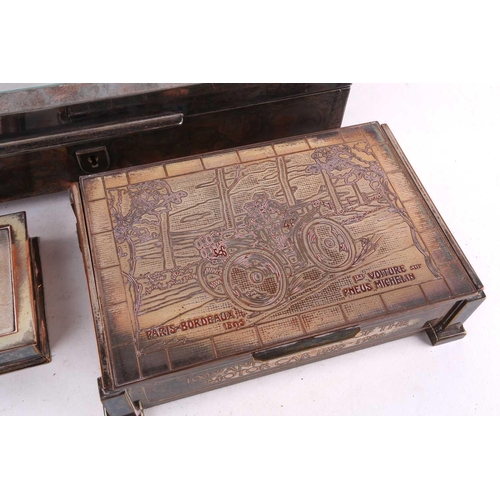 500 - Three silver plated cigar boxes comprising a humidor with a hinged cover inset with a 20th century p... 