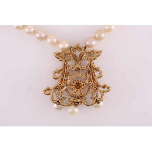 61 - A pearl necklace with a diamond-set pendant, the axe-shaped pendant comprises intricated foliate and... 