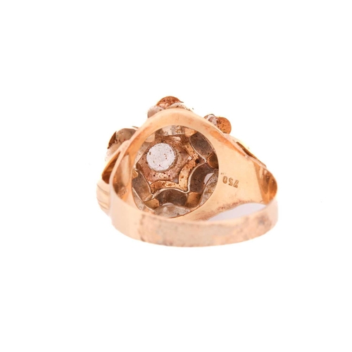 69 - A dress ring set with a synthetic spinel, centred with a colourless synthetic spinel in hexagonal pa... 