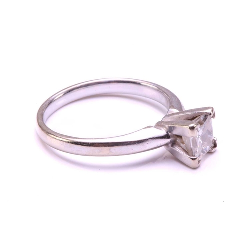 71 - A single-stone diamond ring. The princess cut diamond in raised four claw mount. The diamond is esti... 