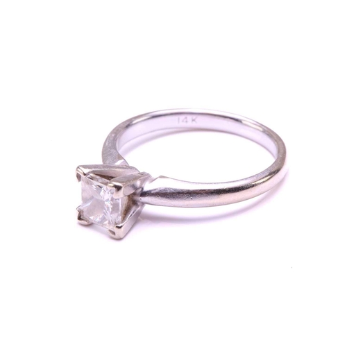 71 - A single-stone diamond ring. The princess cut diamond in raised four claw mount. The diamond is esti... 