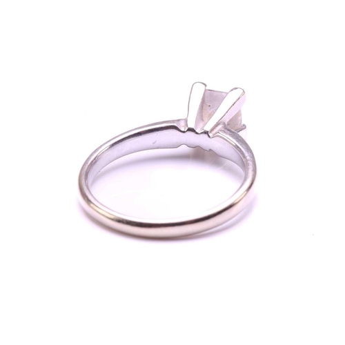 71 - A single-stone diamond ring. The princess cut diamond in raised four claw mount. The diamond is esti... 