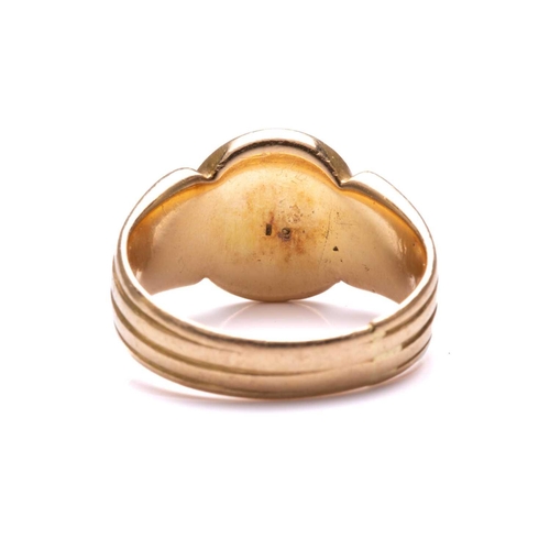 82 - A Victorian signet ring in 18ct yellow gold, with a blank oval ring head to reeded shoulders and sha... 