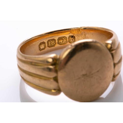 82 - A Victorian signet ring in 18ct yellow gold, with a blank oval ring head to reeded shoulders and sha... 