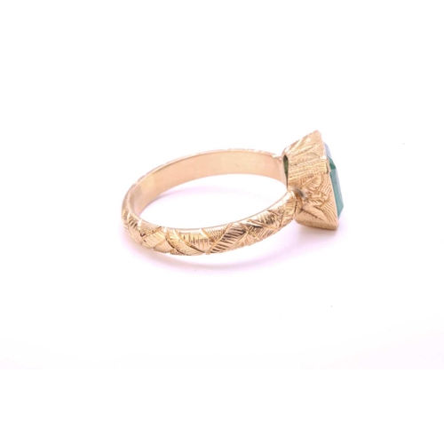 90 - An emerald solitaire ring in 18ct gold, comprising an emerald-cut emerald in light green colour, app... 