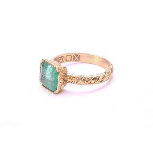 90 - An emerald solitaire ring in 18ct gold, comprising an emerald-cut emerald in light green colour, app... 