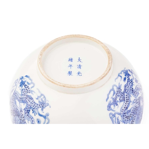 204 - A Chinese porcelain blue & white 'Dragon' bowl, the interior and exterior painted with a writhing sc... 