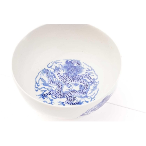 204 - A Chinese porcelain blue & white 'Dragon' bowl, the interior and exterior painted with a writhing sc... 