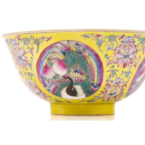 205 - A Chinese porcelain bowl, painted with roundels of cranes and peaches, bordered by lotus flowers and... 