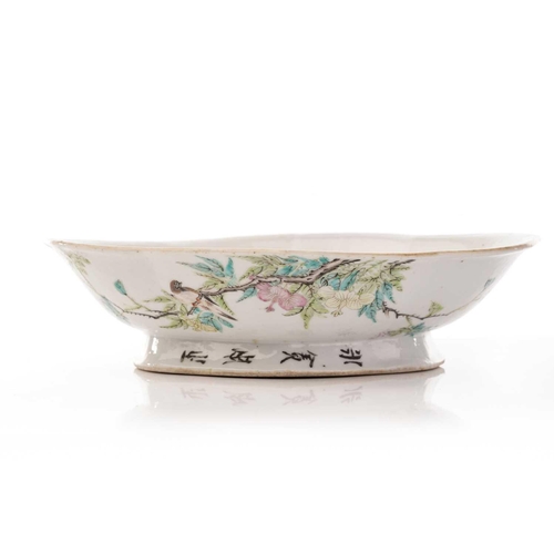 211 - A Chinese porcelain lozenge shape shallow bowl, early 20th century, painted with a bird upon a flowe... 