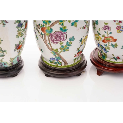 213 - A pair of Chinese Famile rose porcelain baluster vase form table lamps, 20th century, painted with c... 