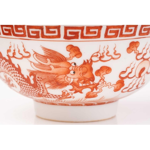 216 - A pair of Chinese porcelain Dragon & Fenghuang bowls, painted in iron red opposing each other facing... 