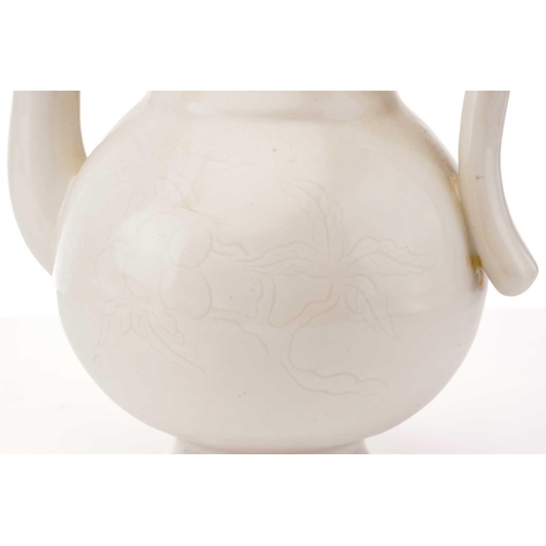 218 - A Chinese Qinbai-style porcelain wine ewer and cover of baluster form with anhua fruiting peach tree... 