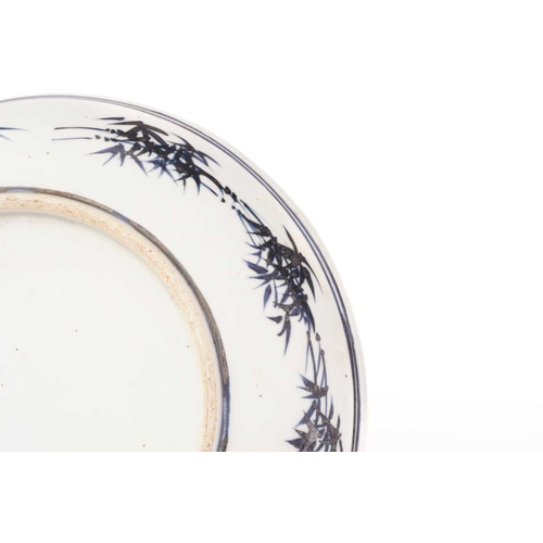 224 - A Chinese porcelain 'Dragon' dish, painted with a writhing and snarling dragon amongst tightly compa... 