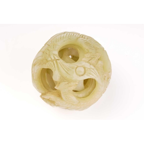 225 - A Chinese-carved pale green jade five-layer puzzle ball, 20th/21st century, the exterior carved with... 