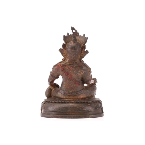 226 - A patinated bronze figure of a seated Manjusri with Nakula at his left hand and a lotus pod in his r... 