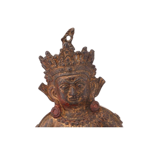 226 - A patinated bronze figure of a seated Manjusri with Nakula at his left hand and a lotus pod in his r... 