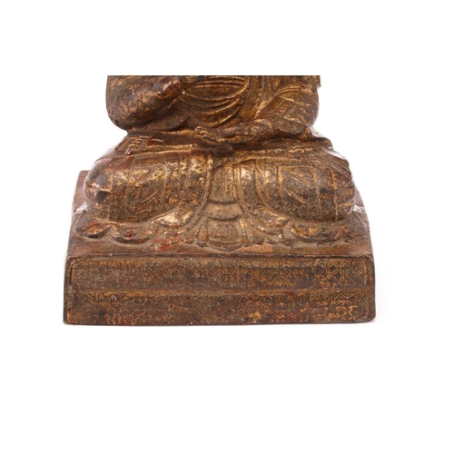 240 - A gilt-bronze figure of the Buddha seated in Vitaka mudra on a simple rectangular plinth. 17 cm wide... 