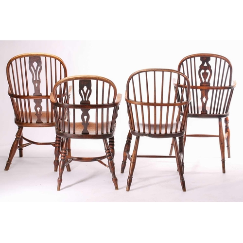 254 - A group of four 19th-century Windsor elm and ash open armchairs with hoop backs and shaped splats ov... 