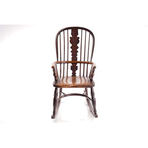 256 - An East Midlands hoop back Windsor rocking armchair, 19th century, with spindle and profile splat ba... 