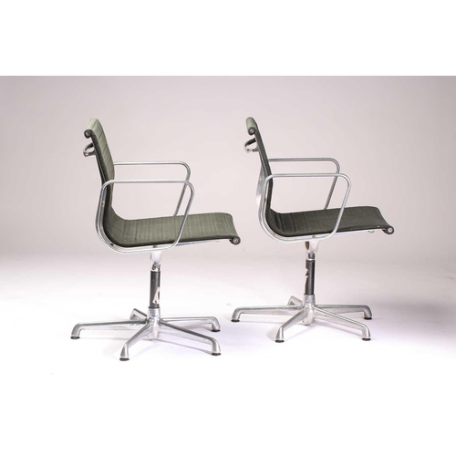 264 - A pair of Charles Eames vintage ICF (licensed) aluminium group armchairs with dark green hopsack uph... 