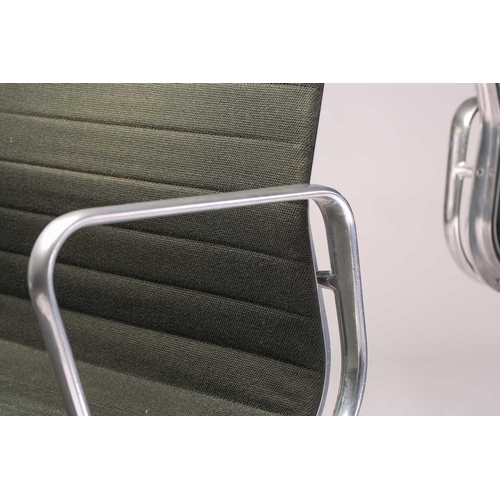 264 - A pair of Charles Eames vintage ICF (licensed) aluminium group armchairs with dark green hopsack uph... 