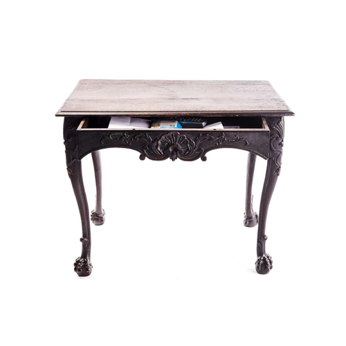 281 - An early 18th-century style carved oak side table with a single frieze drawer with a large shell mot... 