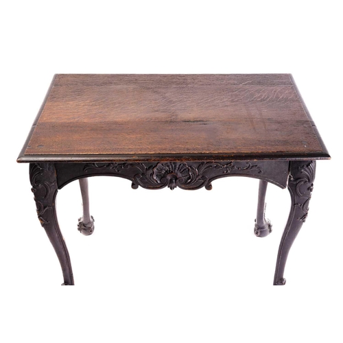 281 - An early 18th-century style carved oak side table with a single frieze drawer with a large shell mot... 