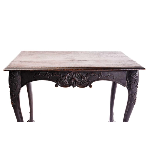 281 - An early 18th-century style carved oak side table with a single frieze drawer with a large shell mot... 