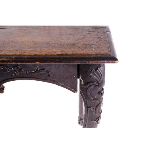 281 - An early 18th-century style carved oak side table with a single frieze drawer with a large shell mot... 