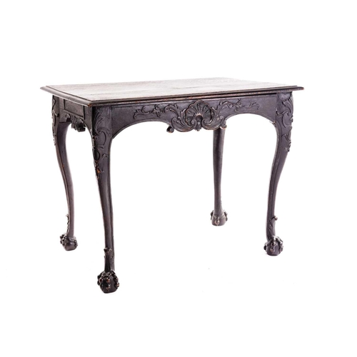 281 - An early 18th-century style carved oak side table with a single frieze drawer with a large shell mot... 