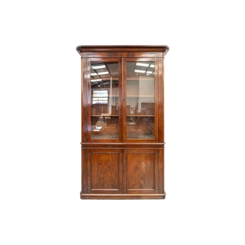 284 - A near pair of Mid-Victorian mahogany bookcases, the moulded protruding cornices over pairs of glaze... 