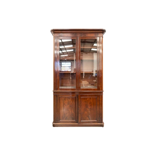 284 - A near pair of Mid-Victorian mahogany bookcases, the moulded protruding cornices over pairs of glaze... 