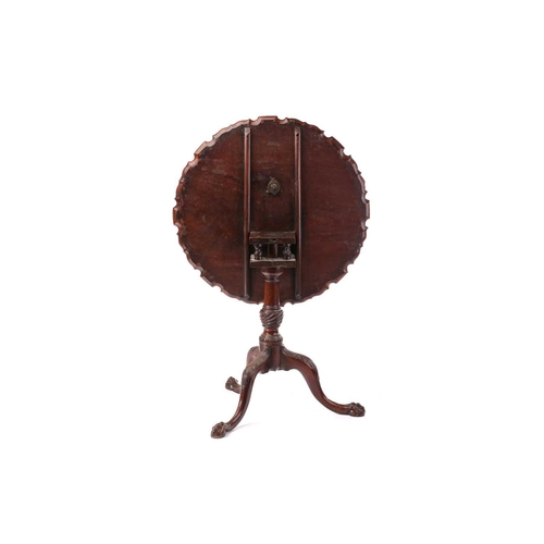 286 - A George III mahogany piecrust edged circular snap top tripod table, with birdcage and gadrooned urn... 