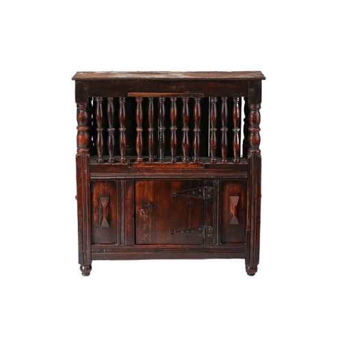 288 - A fruit wood dole cupboard, 17th century and later , the upper section enclosed by turned spindles a... 