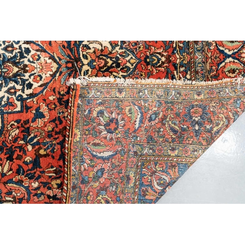 301 - A red ground Biidjar rug with medallion and corner design within broad borders. 202 cm x 146 cm, tog... 