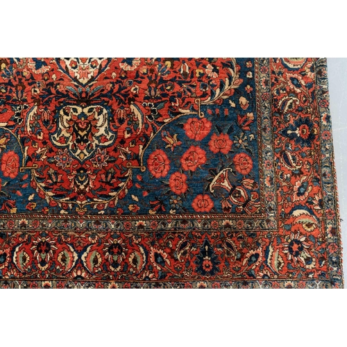 301 - A red ground Biidjar rug with medallion and corner design within broad borders. 202 cm x 146 cm, tog... 