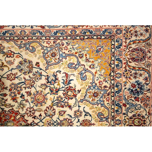 309 - An ivory ground Isfahan rug with central star boss and hanging lanterns on a field of palmetes and s... 