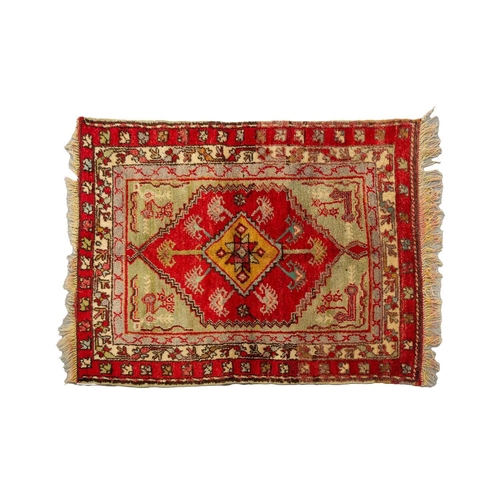 314 - A small North West Persian rd ground rug with stylized shrub decoration. 1.4 mtrs x 1 mtr, together ... 