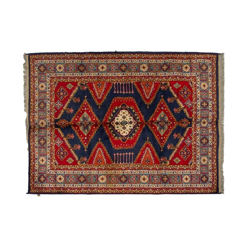 314 - A small North West Persian rd ground rug with stylized shrub decoration. 1.4 mtrs x 1 mtr, together ... 